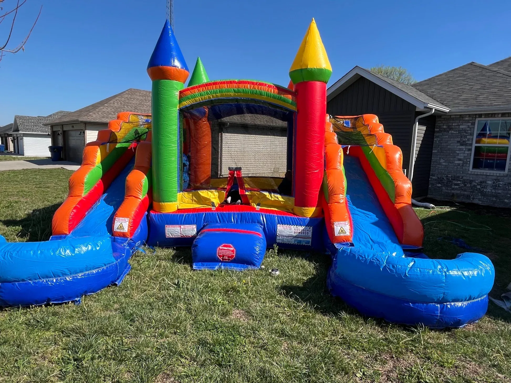 The Castle Combo bounce house rental in Springfield MO on a lawn
